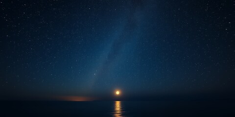 Bright full moon glowing over a dark ocean under a vast starry night sky