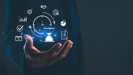 A hand holds digital icons representing time management, data analysis, and productivity in a...