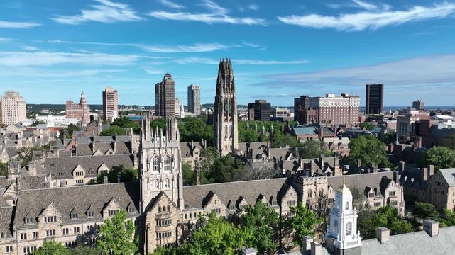 Aerial View Of A City Skyline And Yale University With Gothic-style College Buildings And A Tall Clock Tower in New Haven, Connecticut, USA.