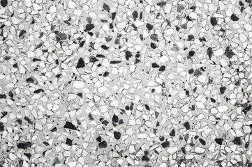 background with a rough sidewalk texture with natural white pebbles. Surface of decorative pavement