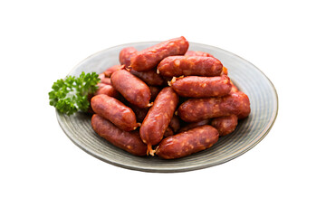 Pile of deliciously cooked small sausages arranged on a white plate with fresh parsley garnish