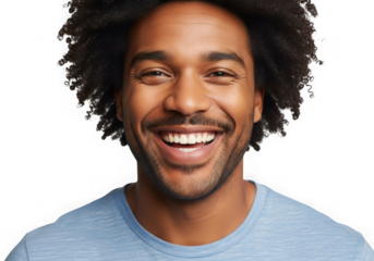 Joyful black man with curly hair smiling widely wearing a light blue t-shirt studio portrait isolated on transparent background
