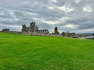 Whitby Harbour and Town in North Yorkshire England with Colourful Fishing Boats, Historic Abbey Ruins and Seaside Scenery on the Yorkshire Coast