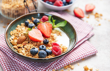 Granola bowl with fresh berries yogurt and nuts
