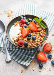 Granola bowl with fresh berries for healthy breakfast