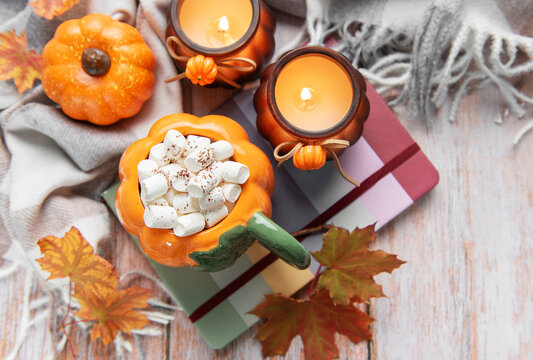 Autumn hot chocolate with marshmallows and fall decoration
