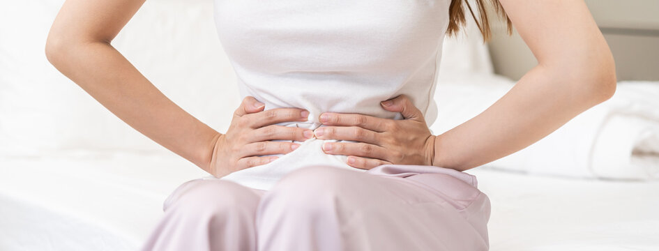 Flatulence ulcer, asian young woman, girl hands in belly, stomach pain from food poisoning, abdominal pain and digestive problem, gastritis or diarrhoea. Abdomen inflammation, menstrual period people.