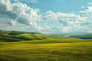 Fototapeta premium Scenic landscape featuring vibrant green hills extending beneath a sky dotted with fluffy white clouds
