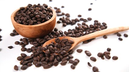 Roasted Coffee Beans in Wooden Bowl and Spoon on White Background
