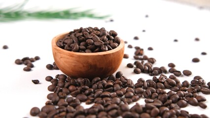 Roasted Coffee Beans in Wooden Bowl on White Surface