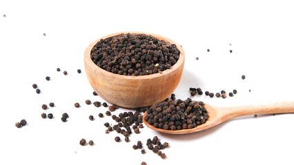 Black Peppercorns: Aromatic Spice in Wooden Bowl and Spoon