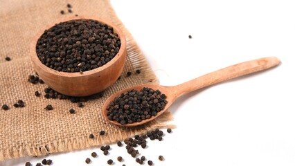 Black Peppercorns: Aromatic Spice in Wooden Bowl & Spoon