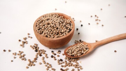 White Peppercorns in Wooden Bowl and Spoon, Close-Up