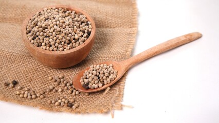 Coriander Seeds: Aromatic Spice in Wooden Dish and Spoon