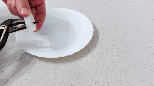 Learn how to safely insert a heated screw into a plastic cap using simple tools and techniques. Quick fix guide for DIY repairs, prototyping, or snug fittings without damage