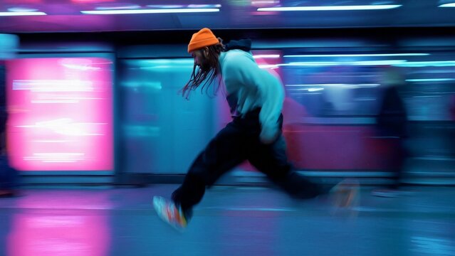 Artistic Blur of Man Walking on Subway Platform Capturing Urban Motion
