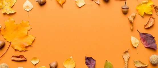 Autumn composition made of dried leaves, cones and acorns on table. Flat lay, top view, copy space