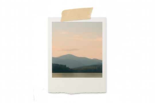 Instant print showing calm lake with mountains, embodying travel memories and cherished nostalgia