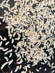 Raw flattened rice close up. Dry rice flakes or poha, Indian breakfast food