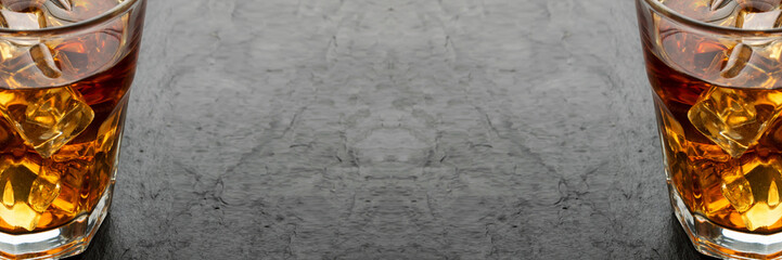 Iced Whiskey Glass on Natural Black Stone Background