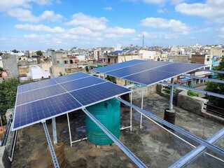 Rooftop Solar Panels Installation on a Residential Building in an Indian City