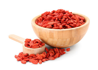 Wooden bowl and spoon with red dried goji berries on white background