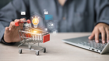 Ecommerce Idea with Shopping Cart and Analytics Icons beside Laptop