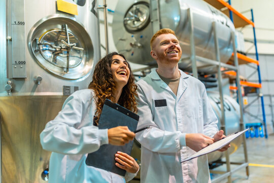 Quality control team working in beer factory brewery