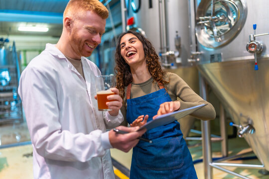 People tasting craft beer in brewery - Powered by Adobe