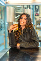 Woman enjoying beer at a microbrewery