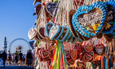 typical ginger bread heart at a kiosk in munich - translation: greetings from the oktoberfest
