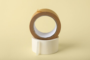 Rolls of masking tape on beige background