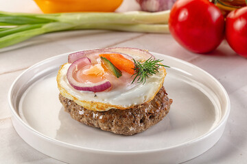 Beefsteak chop with roasted egg