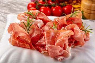 Spanish dry jamon serrano pork meat slices