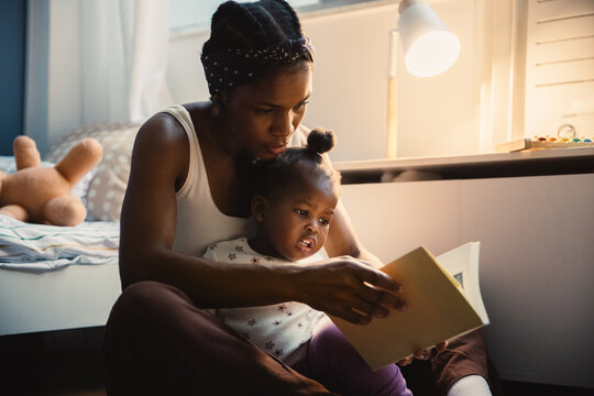 Mother reading with young child