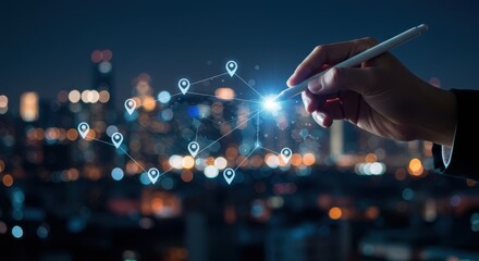 Hand using stylus to draw a digital network map with location pins over a blurred city skyline at night