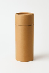 Studio photo of kraft paper cylindrical tube with lid isolated on white background, eco-friendly container mockup for tea, coffee, cosmetic, or organic product packaging, sustainable minimalist design