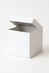 Minimal studio photo of a blank white square cardboard box with open lid on neutral background, clean packaging mockup for gift, cosmetic, jewelry, or small product branding, natural light