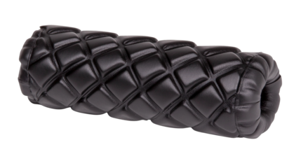 Close up of a black textured foam roller featuring a prominent raised diamond pattern on its cylindrical surface Isolate