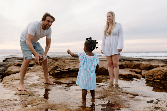 Diverse family on the Beach at sunrise
