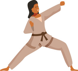 Fototapeta premium Young woman practicing martial arts wearing kimono and brown belt is performing a karate kick