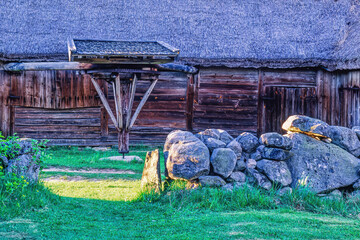 Old timbered barn by a farmyard