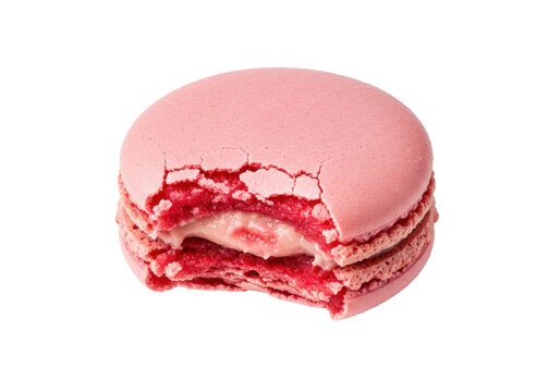 Bitten pink macaron isolated on transparent background, delicious French meringue-based confection for dessert and sweet treat concepts