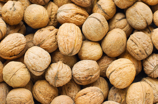 Top view of whole walnuts as background texture