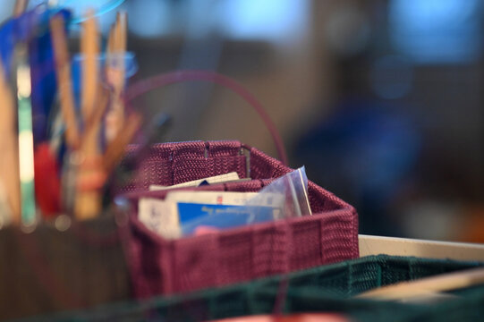 craft kit, note papers and writing materials, blurred background, cozy home feeling