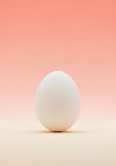 Fototapeta premium An egg stands against a calming pastel backdrop with subtle gradients