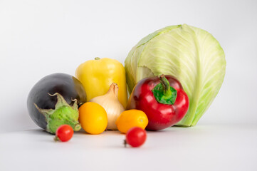 fresh vegetables. tomatoes, bell peppers, onions on a white background