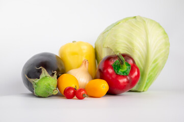 fresh vegetables. tomatoes, bell peppers, onions on a white background