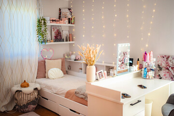Teen girl bedroom with cozy feminine style and fairy lights