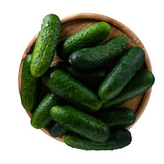 Top view of fresh cucumbers in a wooden bowl isolated on transparent PNG background, perfect for diet, cooking and healthy food concepts.